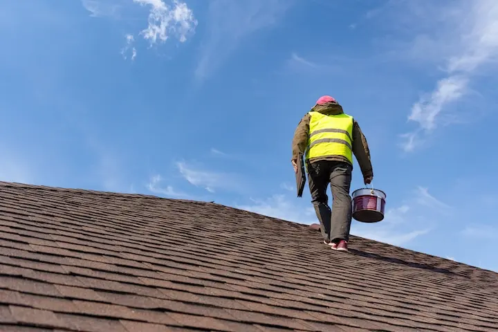 man walking up roof